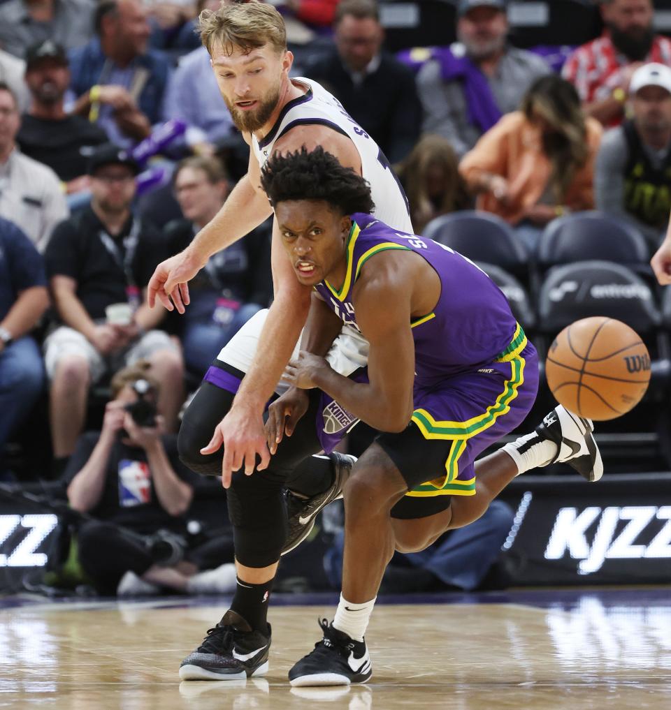 Utah Jazz guard Collin Sexton (2) competes for the ball with Sacramento Kings forward Domantas Sabonis (10) in Salt Lake City on Wednesday, Oct. 25, 2023. The Kings won 130-114. | Jeffrey D. Allred, Deseret News