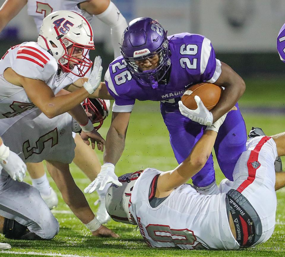 Barberton running back Xzavier Macon carries in the third quarter against Wadsworth on Aug. 19, 2022.