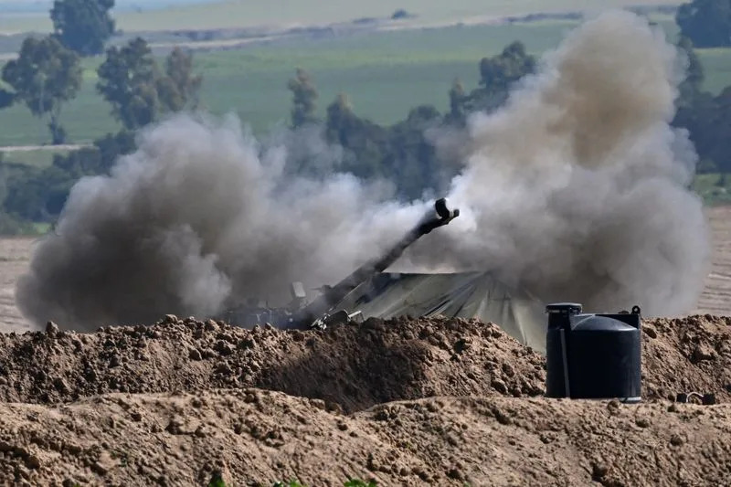 An artillery unit fires towards Gaza