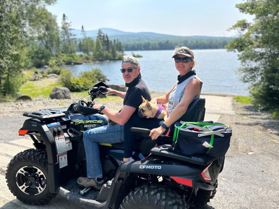 Darin Roark, new president of Wentworth-Douglass Hospital, with his wife, Natasha Roark, and their new ATV. He says the couple is enjoying New Hampshire.