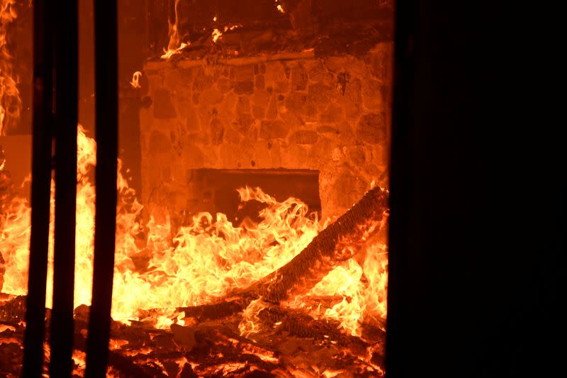 FILE PHOTO: Wildfire in California burns through the night north of Los Angeles