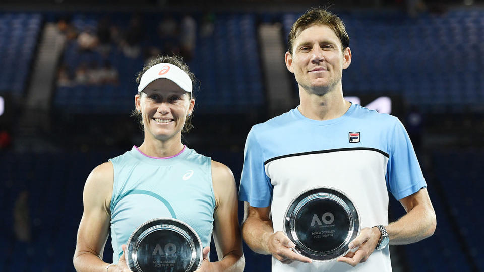 Seen here, Sam Stosur and Matthew Ebden pose with their Australian Open mixed doubles runner-up plates.