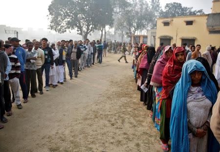 People queue to vote during the state assembly election, in the town of Deoband, in the state of Uttar Pradesh, India, February 15, 2017. REUTERS/Cathal McNaughton
