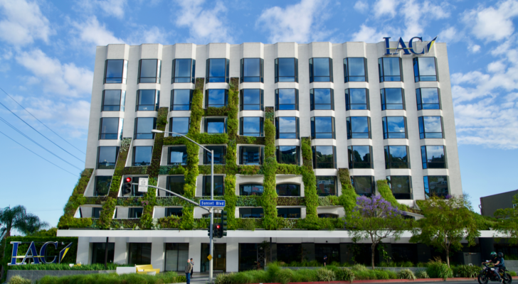 The logo for IAC is seen at the top of an office building.