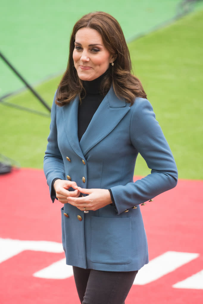 <p><strong>When: October 18, 2017</strong><br>Just a day after announcing the due date of royal baby number three, Kate coyly concealed her growing baby bump in a fitted, double-breasted twill blue blazer by Philosophy di Lorenzo Serafini while making a surprise appearance at the Coach Core graduation ceremony on Wednesday at The London Stadium<br><em>[Photo: Getty]</em> </p>