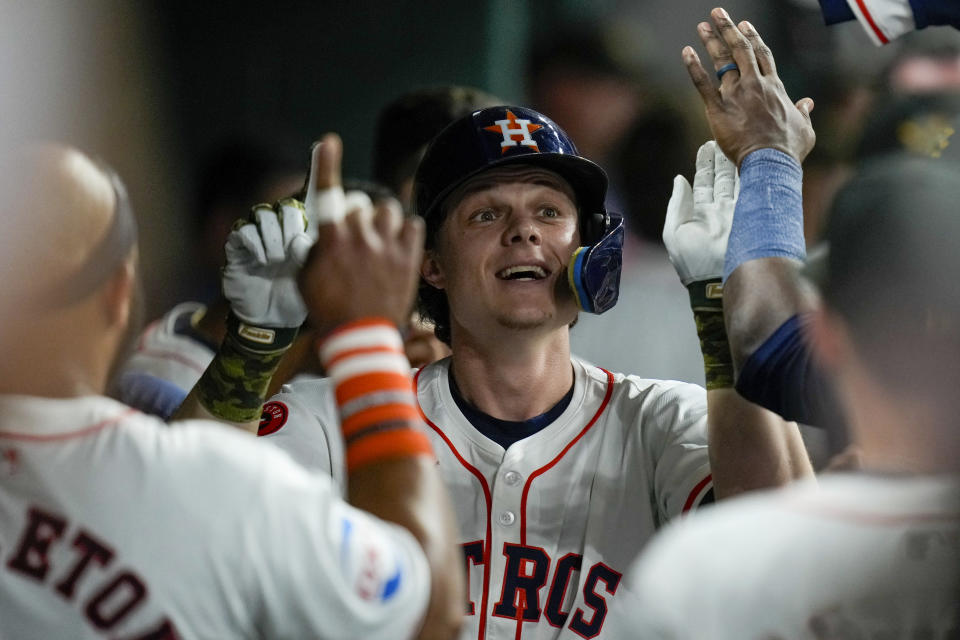 Houston Astros' Jake Meyers, center, celebrates his solo home run against the Milwaukee Brewers during the fifth inning of a baseball game Saturday, May 18, 2024, in Houston. (AP Photo/Eric Christian Smith)
