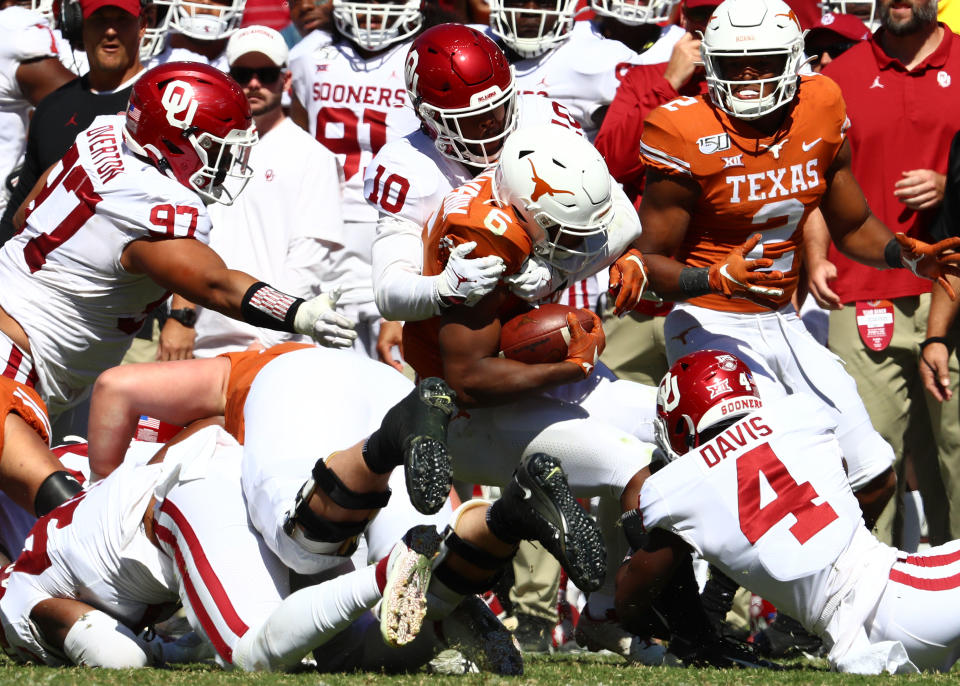 Texas Longhorns receiver Devin Duvernay (6) is tackled by Oklahoma Sooners safety Pat Fields (10) in the third quarter at Cotton Bowl. (USA Today)