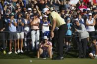 Webb Simpson watches his winning putt on 18th green on the first playoff hole during the final round of the Waste Management Phoenix Open PGA Tour golf event Sunday, Feb. 2, 2020, in Scottsdale, Ariz. (AP Photo/Ross D. Franklin)