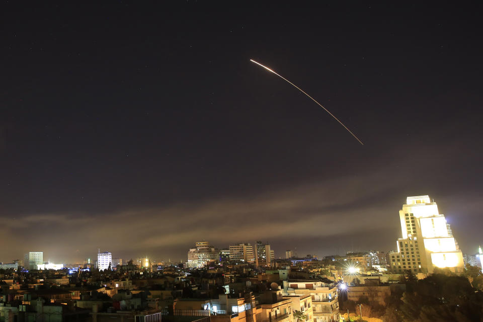 <p>Damascus skies erupt with missile fire as the U.S. launches an attack on Syria targeting different parts of the capital Syria, early Saturday, April 14, 2018. (Photo: Hassan Ammar/AP) </p>