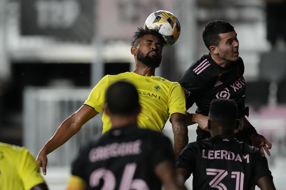 Nashville midfielder Anibal Godoy heads the ball past Inter Miami midfielder Jay Chapman, during the first half of an MLS soccer match, Wednesday, Sept. 22, 2021, in Fort Lauderdale, Fla. (AP Photo/Rebecca Blackwell)