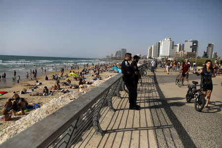 Israeli policemen secure the area near the beach on the eve of the 2019 Eurovision song contest final in Tel Aviv, Israel May 18, 2019 REUTERS/ Ammar Awad