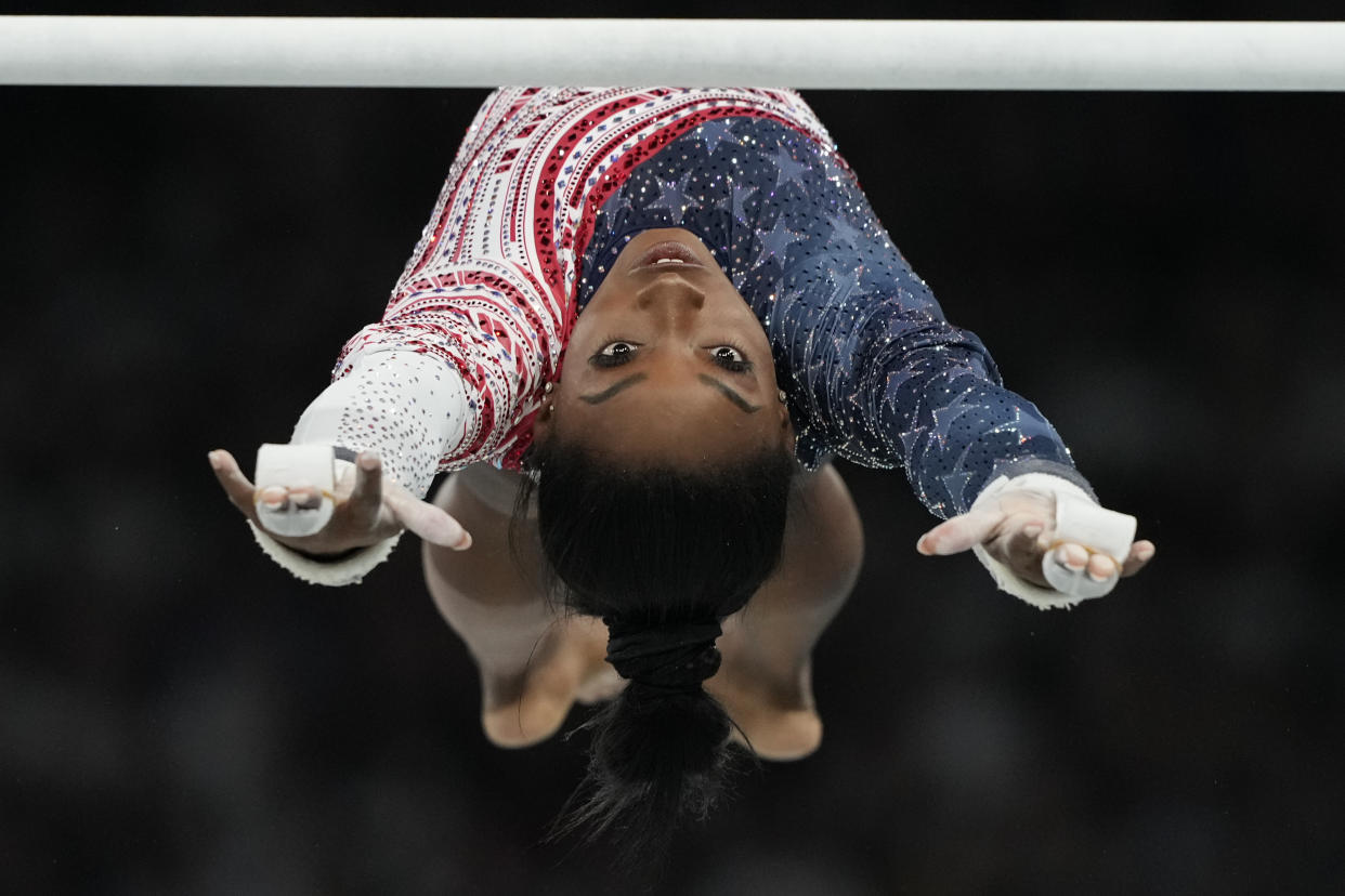 Simone Biles, of the United States, performs on the uneven bars during the women's artistic gymnastics team finals round at Bercy Arena at the 2024 Summer Olympics on July 30, 2024, in Paris, France. (Natacha Pisarenko/AP)