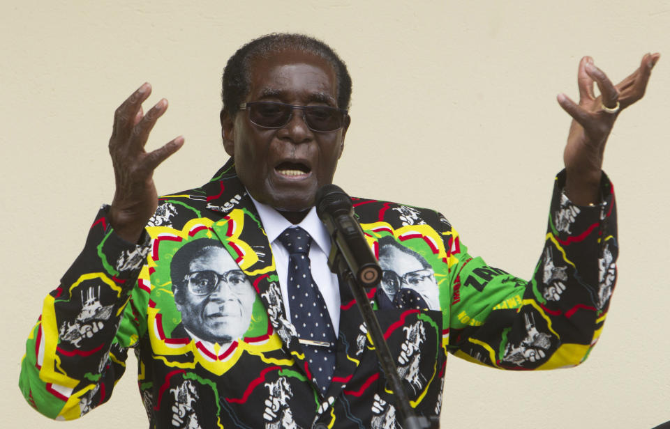 FILE - In this Saturday, Dec, 17, 2016 file photo, Zimbabwean President Robert Mugabe addresses people at an event before the closure of his party's 16th Annual Peoples Conference in Masvingo, south of the capital Harare. On Friday, Sept. 6, 2019, Zimbabwe President Emmerson Mnangagwa said his predecessor Mugabe, age 95, has died. (AP Photo/Tsvangirayi Mukwazhi, File)