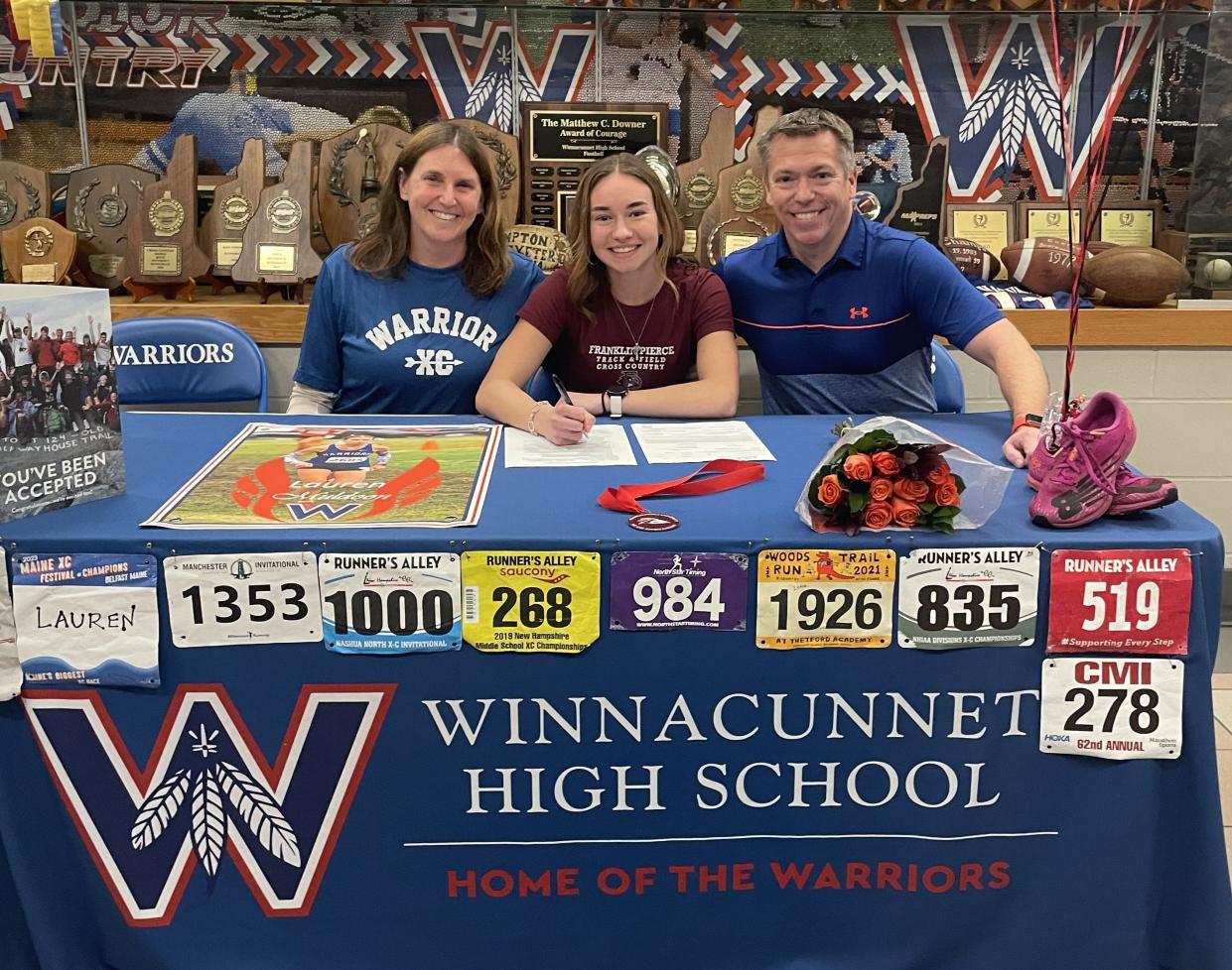 Winnacunnet High School senior Lauren Muldoon, center, recently announced her commitment to run cross country and track and field at Franklin Pierce University. Muldoon is joined by her parents, Monica and Michael.