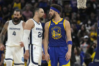 Golden State Warriors guard Klay Thompson (11) and Memphis Grizzlies forward Dillon Brooks (24) argue with each other during the first half of Game 6 of an NBA basketball Western Conference playoff semifinal in San Francisco, Friday, May 13, 2022. (AP Photo/Tony Avelar)