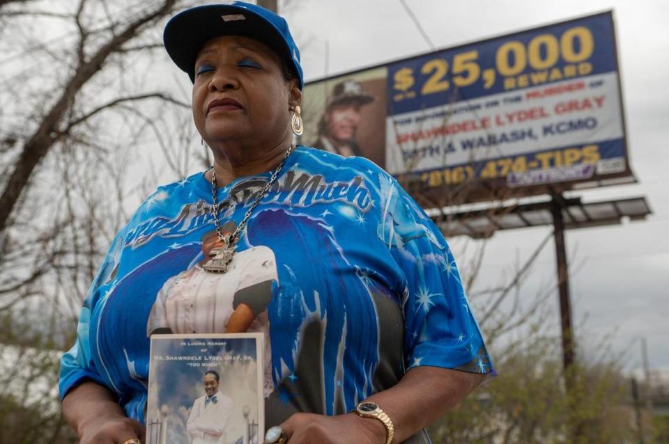 Sherry Paige is seen holding a photo of her son on Thursday, March 30, 2023, in Kansas City. Paige commissioned a billboard hoping to seek justice for the death of her son, Shawndelle Lyle Gray, who was found shot inside his vehicle two years ago.