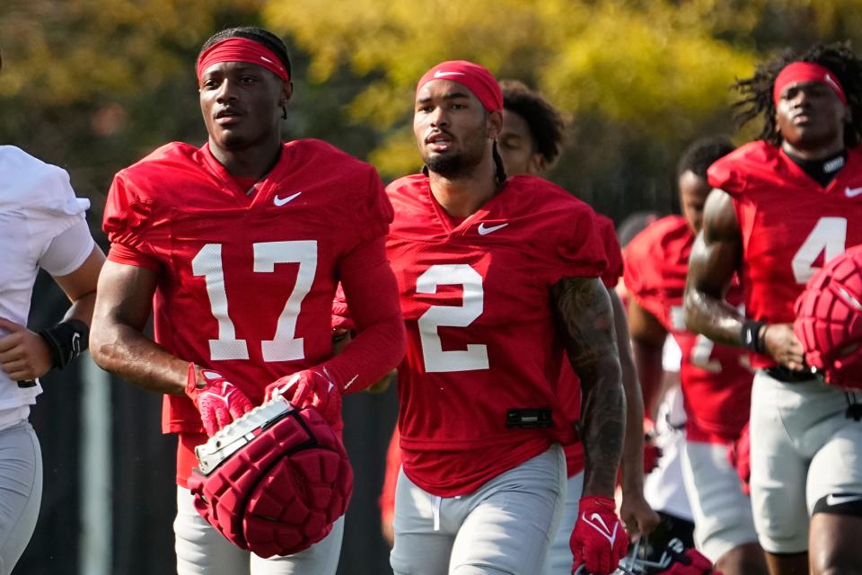 Ohio State wide receiver Carnell Tate (17) runs between drills during fall camp at the Woody Hayes Athletic Complex.