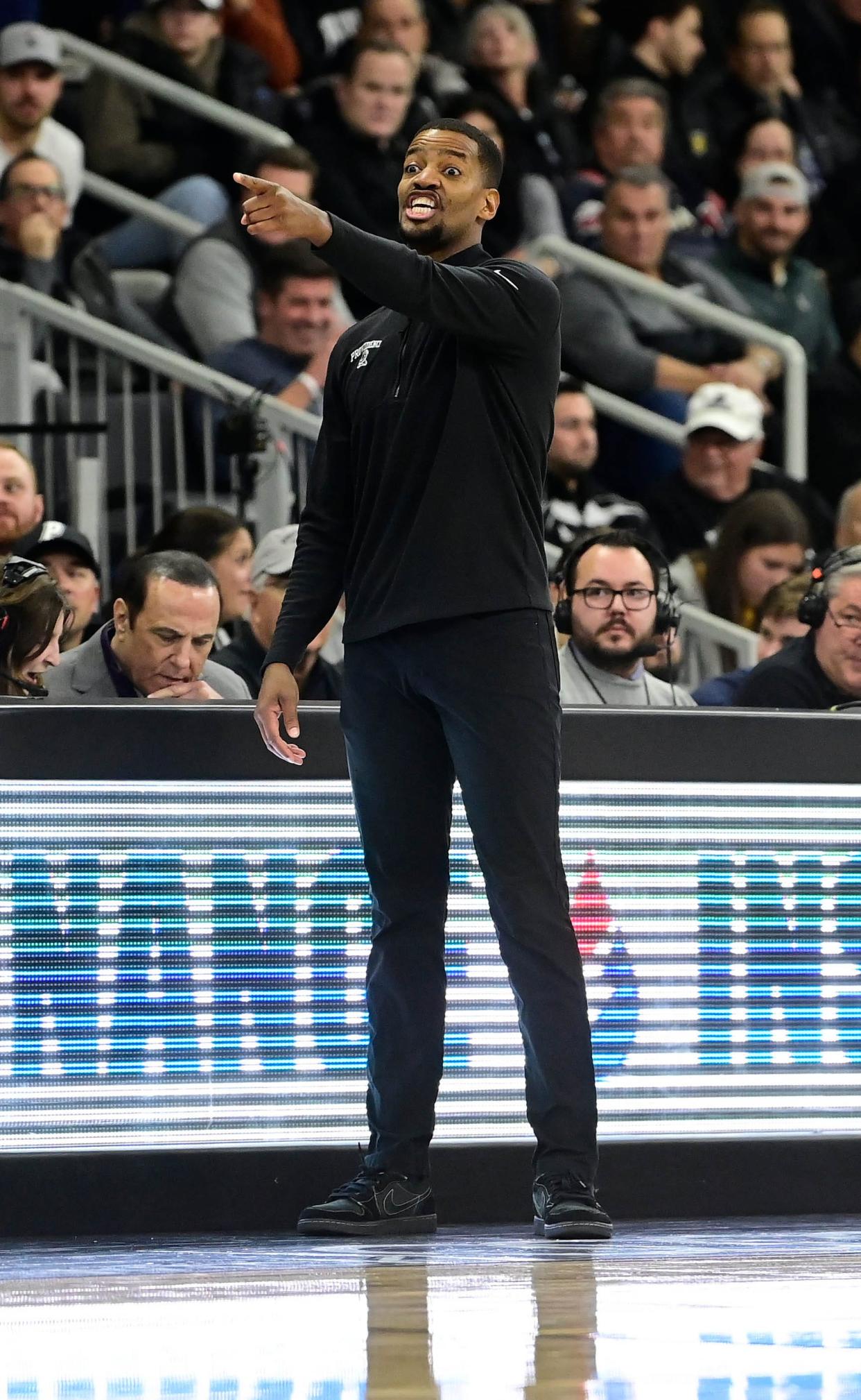 Dec 19, 2023; Providence, Rhode Island, USA; Providence Friars head coach Kim English reacts to game action against the Marquette Golden Eagles during the first half at Amica Mutual Pavilion. Mandatory Credit: Eric Canha-USA TODAY Sports