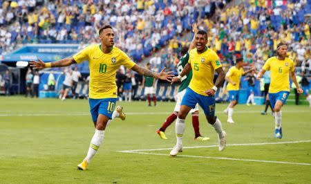 Brazil's Neymar celebrates scoring their first goal. REUTERS/Carlos Garcia Rawlins