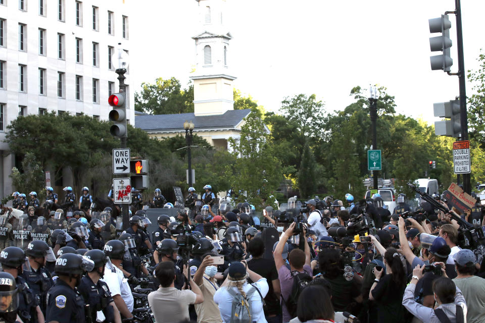 Police clear the area around Lafayette Park and the White House as demonstrators gather to protest the death of George Floyd, Monday, June 1, 2020, in Washington. Floyd died after being restrained by Minneapolis police officers. (AP Photo/Alex Brandon)