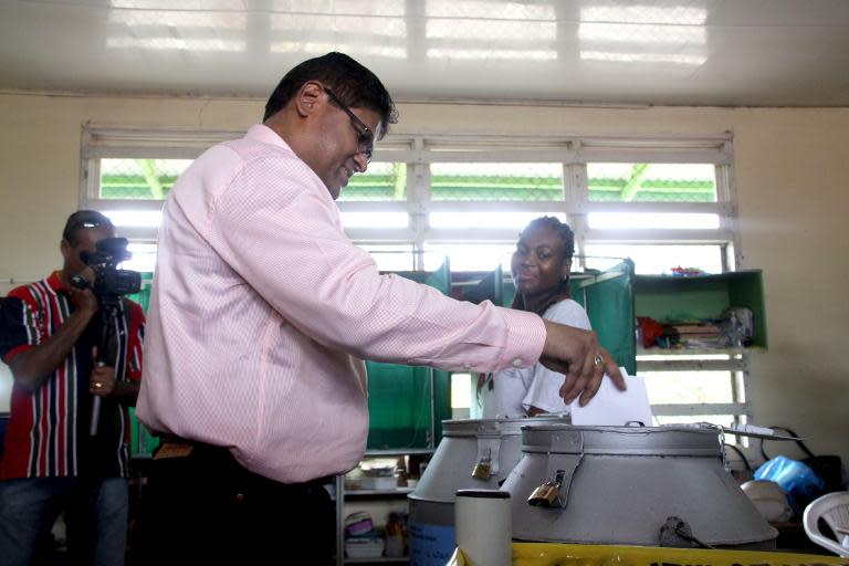 Suriname's opposition leader Chandrikapersad Santokhi votes at a polling station in Lelydorp, Wanica, Surinam on May 25, 2015