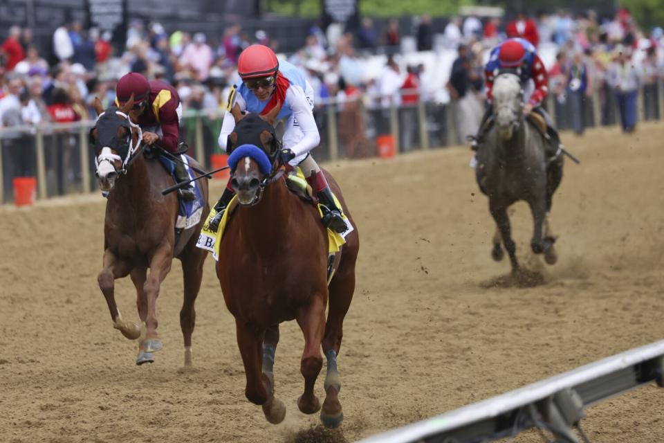 Arabian Lion, with jockey John Velazquez, wins the Sir Barton Stakes at Pimlico Racecourse May 20.