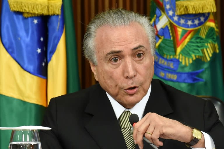 Acting Brazilian President Michel Temer presents his economic measures during a meeting with the leaders of allied parties in Congress at the Planalto Palace in Brasilia on May 24, 2016