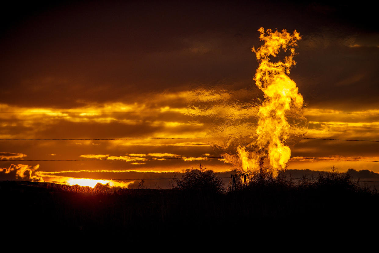 Flames from a flaring pit near a well in the Bakken oil field, which spans Montana, North Dakota and parts of Canada. The primary component of natural gas is methane. (Photo: Orjan F. Ellingvag via Getty Images)