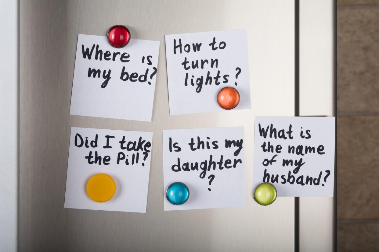 post-it notes on fridge door asking reminder questions