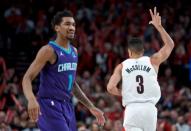 Jan. 11, 2019; Portland, OR, USA; Portland Trail Blazers guard CJ McCollum (3) reacts after making a three-point basket over Charlotte Hornets guard Malik Monk (1) during the third quarter at the Moda Center. Mandatory Credit: Craig Mitchelldyer-USA TODAY Sports
