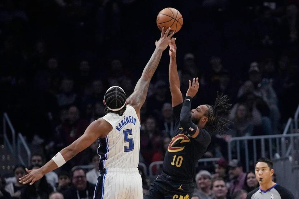 Cleveland Cavaliers guard Darius Garland (10) shoots in front of Orlando Magic forward Paolo Banchero (5) on Wednesday in Cleveland.