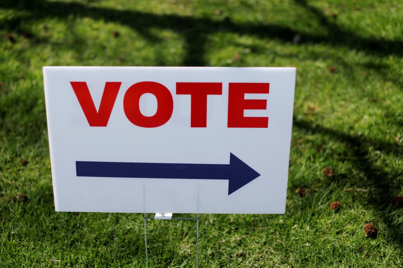 A Vote sign directs voters to an early polling station for the March 3 Super Tuesday primary in Santa Ana California