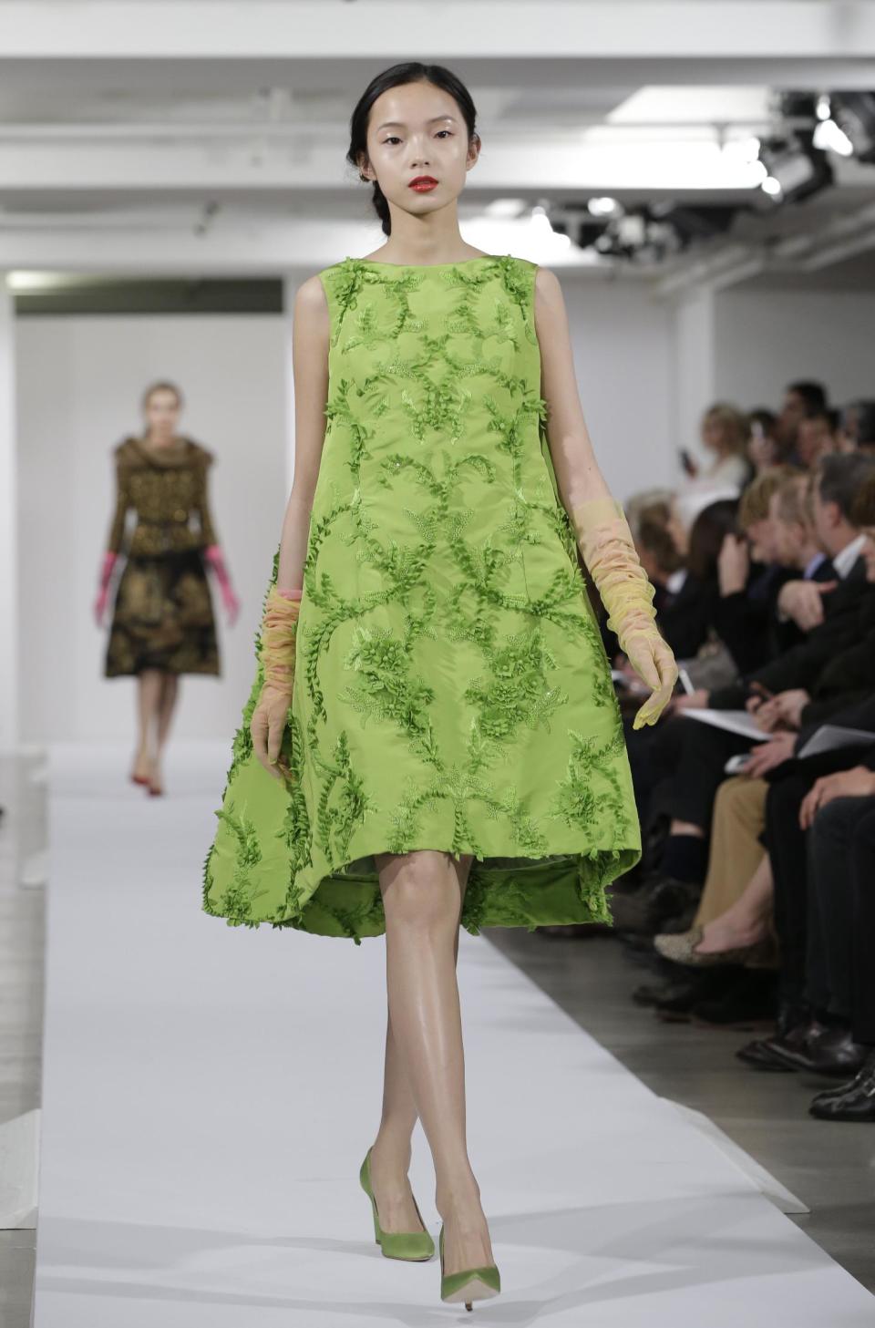 Fashion from the Oscar de la Renta Fall 2013 show is modeled during Fashion Week in New York, Tuesday, Feb. 12, 2013. (AP Photo/Kathy Willens)