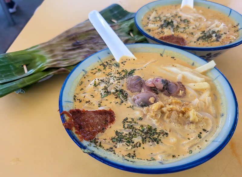 63 laksa - bowl of laksa with cockles