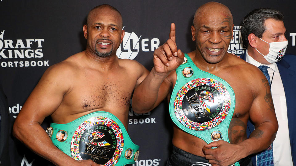 Roy Jones Jr and Mike Tyson, pictured here celebrating their split draw.