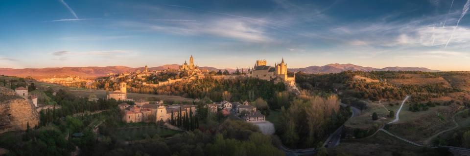 segovia city skyline at dusk, with the cathedral and castle