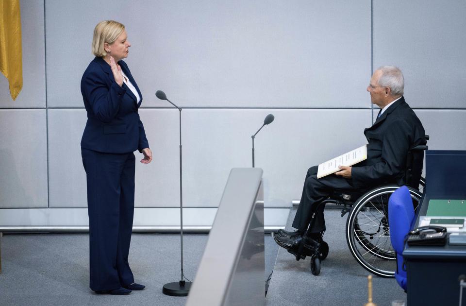 Eva Hoegl is sworn in by Wolfgang Schaeuble, President of the Bundestag, as the new Commissioner for the Armed Forces of the German parliament Bundestag at the beginning of the session in Berlin, Germany, Thursday, May 28, 2020. Hoegl succeeds Hans-Peter Bartels, who retired from office after five years. (Kay Nietfeld/dpa via AP)