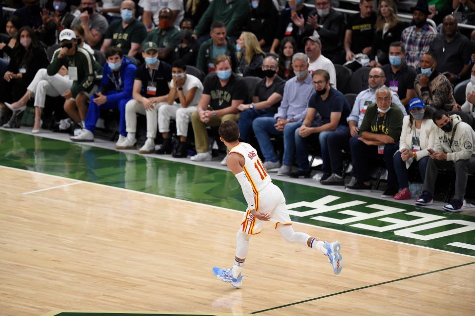 Trae Young has some words for the Bucks fans after a second-quarter 3-pointer during the Hawks' Game 1 win in Milwaukee.