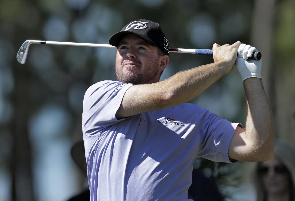 Robert Garrigus tees off on the eighth hole during the second round of the Valspar Championship golf tournament at Innisbrook Friday, March 14, 2014, in Palm Harbor, Fla. (AP Photo/Chris O'Meara)