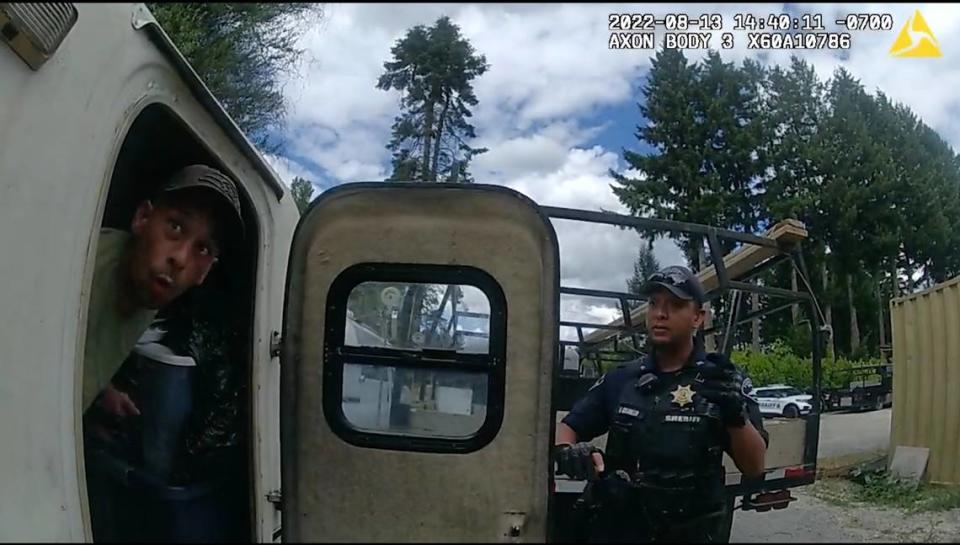 Pierce County Sheriff’s Dep. Ernest Cedillo (right) opens to door of a trailer that Jeremiah Connors, 41, was living in Puyallup in this body camera footage taken on Aug. 13, 2022.