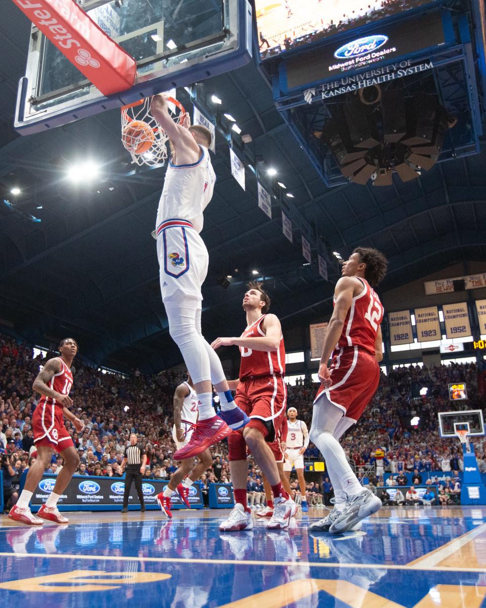 Kansas senior center Hunter Dickinson (1) dunks over Oklahoma in the first half of the game Saturday, Jan. 13, 2024, inside Allen Fieldhouse.