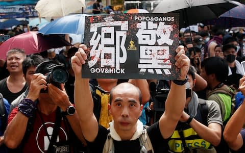 People demonstrate outside the police station during a protest against the Yuen Long attacks in Yuen Long - Credit: &nbsp;REUTERS/Edgar Su