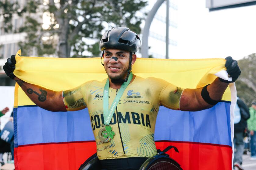 Los Angeles, CA - March 17: Francisco Sanclemente is the first place wheelchair winner during the 39th running of the Los Angeles Marathon presented by ASICS at the finish line on Sunday, March 17, 2024 in Los Angeles, CA. (Dania Maxwell / Los Angeles Times)