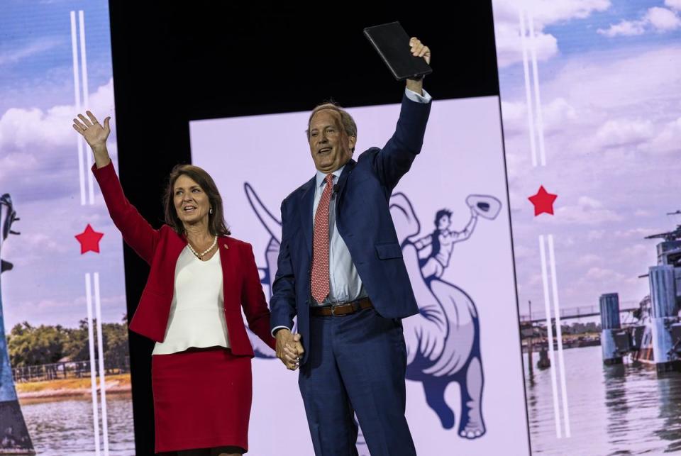 Texas Attorney General Ken Paxton and his wife Senator Angela Paxton wave to conventioneers during the Texas GOP Convention Thursday, May 23, 2024 in San Antonio.