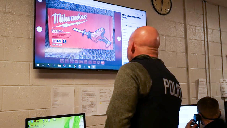 Det. Sgt. Todd Curtis of the Perrysburg Township Police Department scrolls through Facebook Marketplace looking for users who are selling stolen power tools taken off of store shelves. (David Paredes / NBC News)