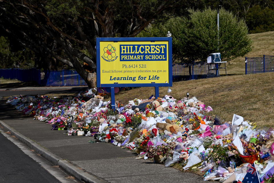 Hillcrest primary school sign surrounded by flowers.