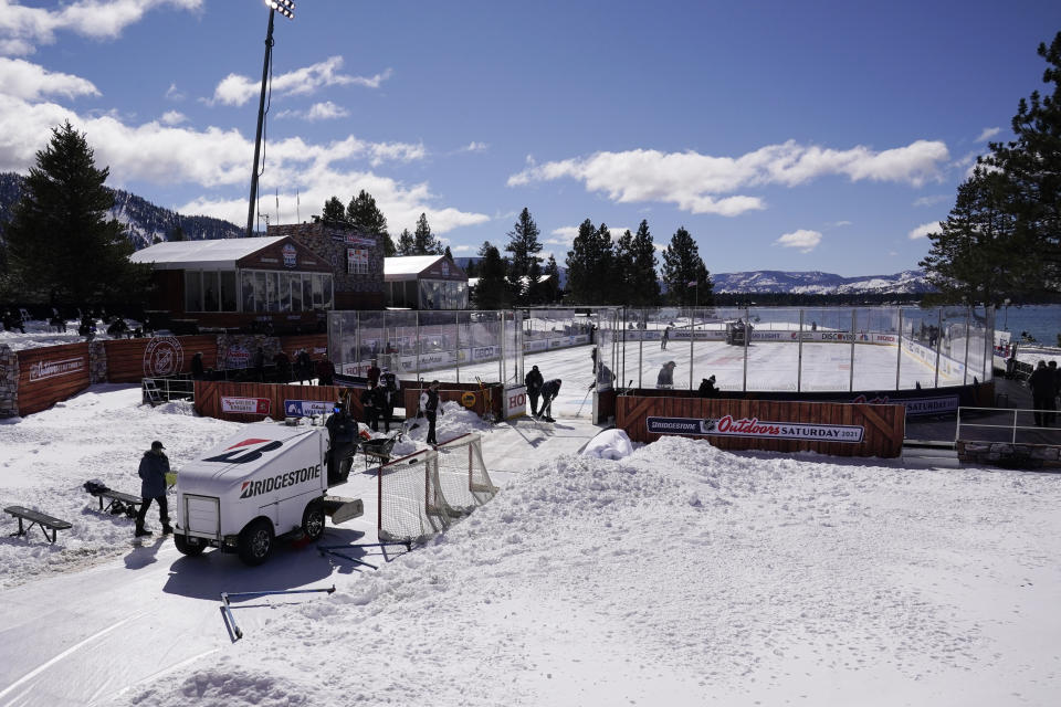 A Zamboni machine leaves the outdoor rink where the Vegas Golden Knights and Colorado Avalanche will play in the Outdoor Lake Tahoe NHL hockey game at Stateline, Nev., Saturday, Feb. 20, 2021. (AP Photo/Rich Pedroncelli)