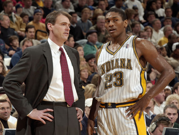 Rick Carlisle and Metta World Peace 2003-it up. (Getty Images)