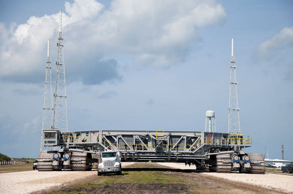 NASA's crawler-transporter 2, also known as CT-2, moves slowly along the crawlerway on a test run to Launch Pad 39B at NASA's Kennedy Space Center in Florida.