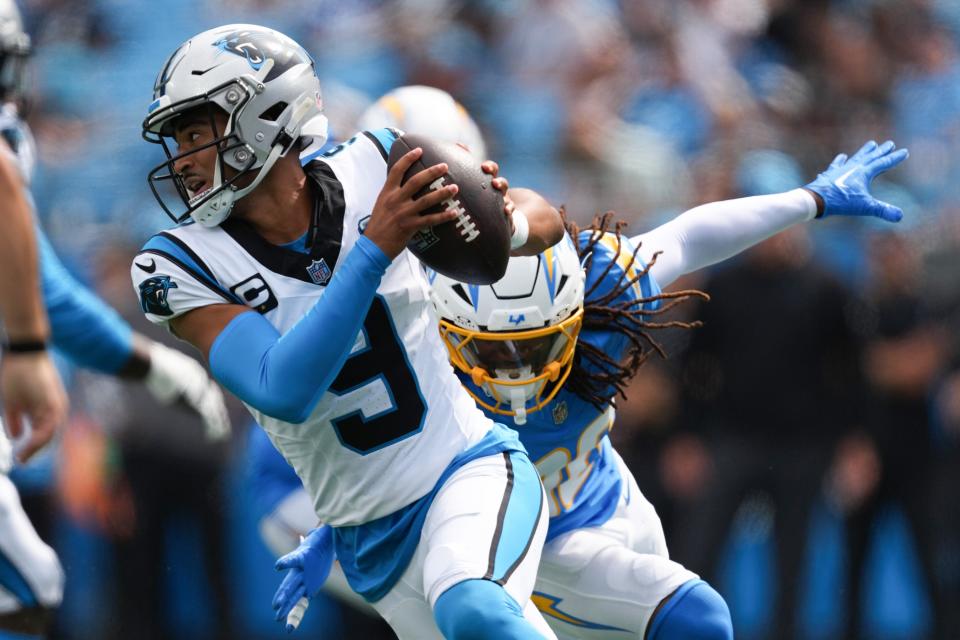 CHARLOTTE, NORTH CAROLINA - SEPTEMBER 15: Quarterback Bryce Young #9 of the Carolina Panthers rolls out under pressure from Kimani Vidal #30 of the Los Angeles Chargers during the third quarter at Bank of America Stadium on September 15, 2024 in Charlotte, North Carolina. (Photo by Grant Halverson/Getty Images) ORG XMIT: 776151343 ORIG FILE ID: 2172204771